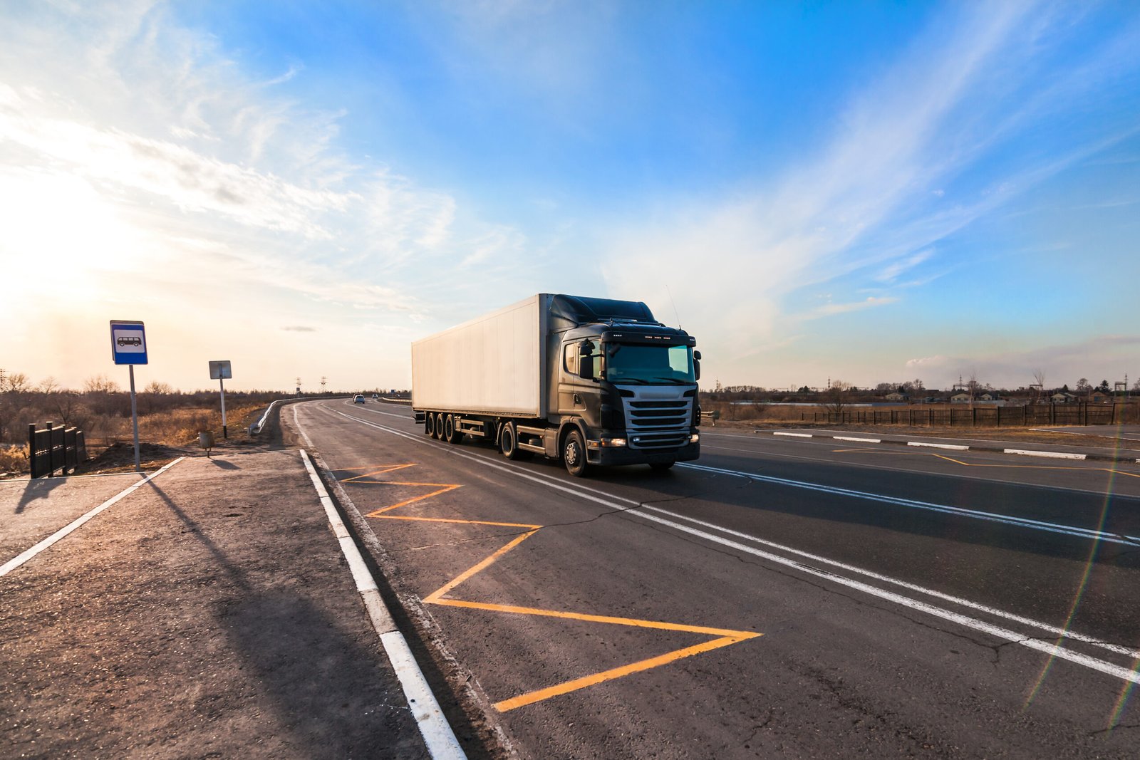 black truck moving at city's suburb