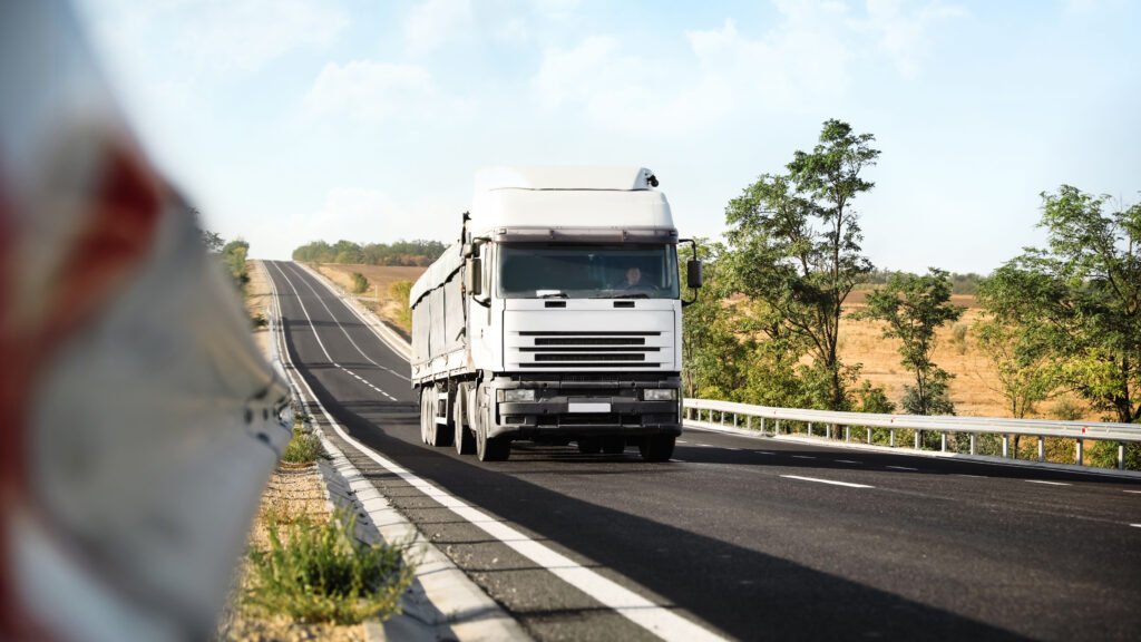 beautiful view of asphalt highway with truck. road trip